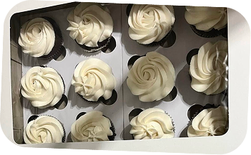 Classic vanilla buttercream cupcakes freshly baked for a celebration.