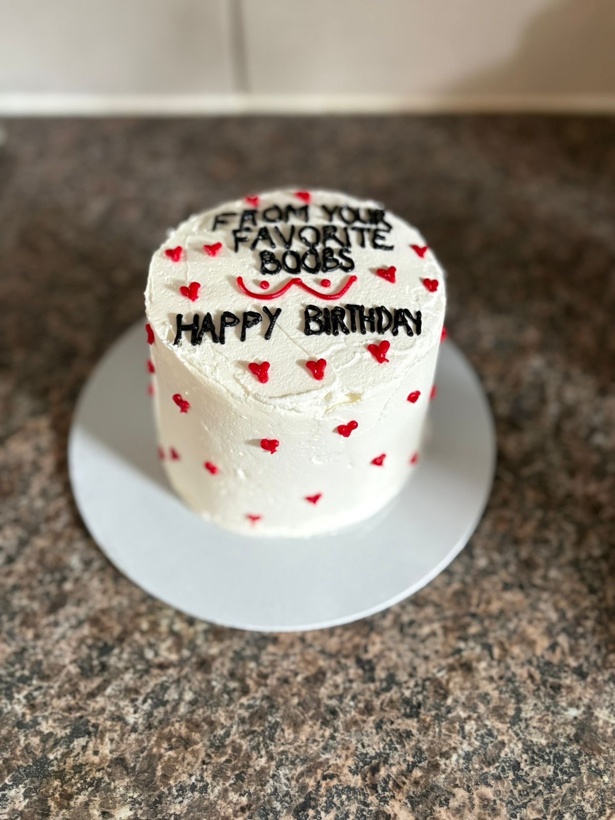 White buttercream bento birthday cake with red heart decorations and a funny custom birthday message