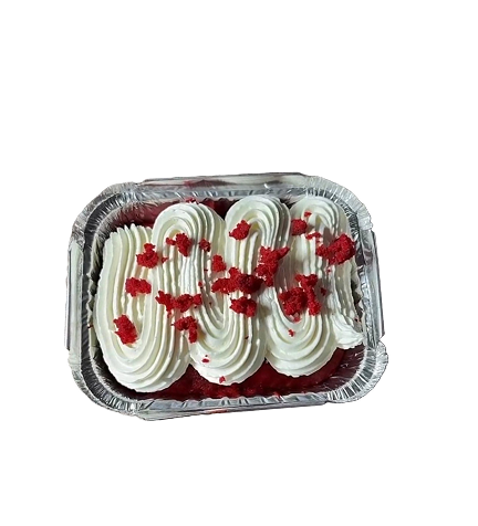 Mini red velvet cake topped with smooth cream frosting and red velvet cake crumbs.