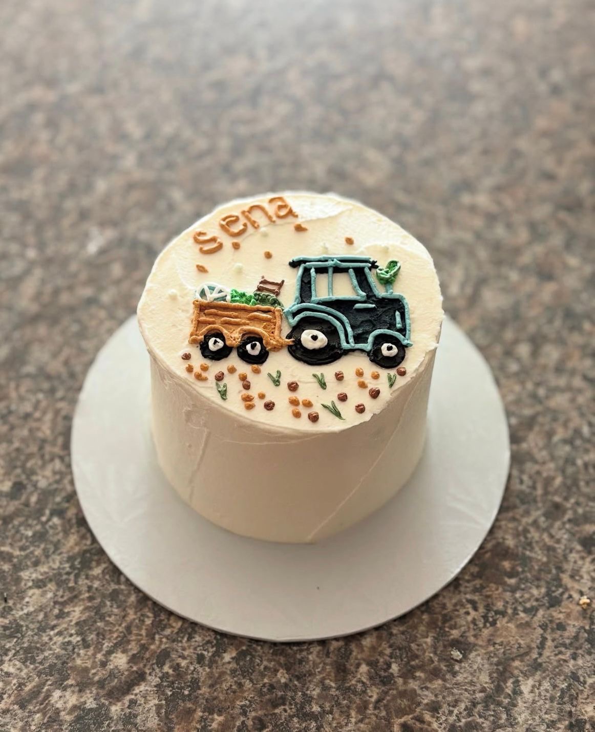 Personalized baby boy birthday cake with tractor design and custom name
